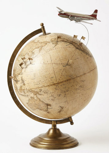 A globe (of the earth) with an airplane showing destinations of places been A globe (of the earth) with an airplane showing destinations of places been